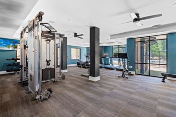 Cardio and strength training fitness center with peloton bike and lifefitness equipment